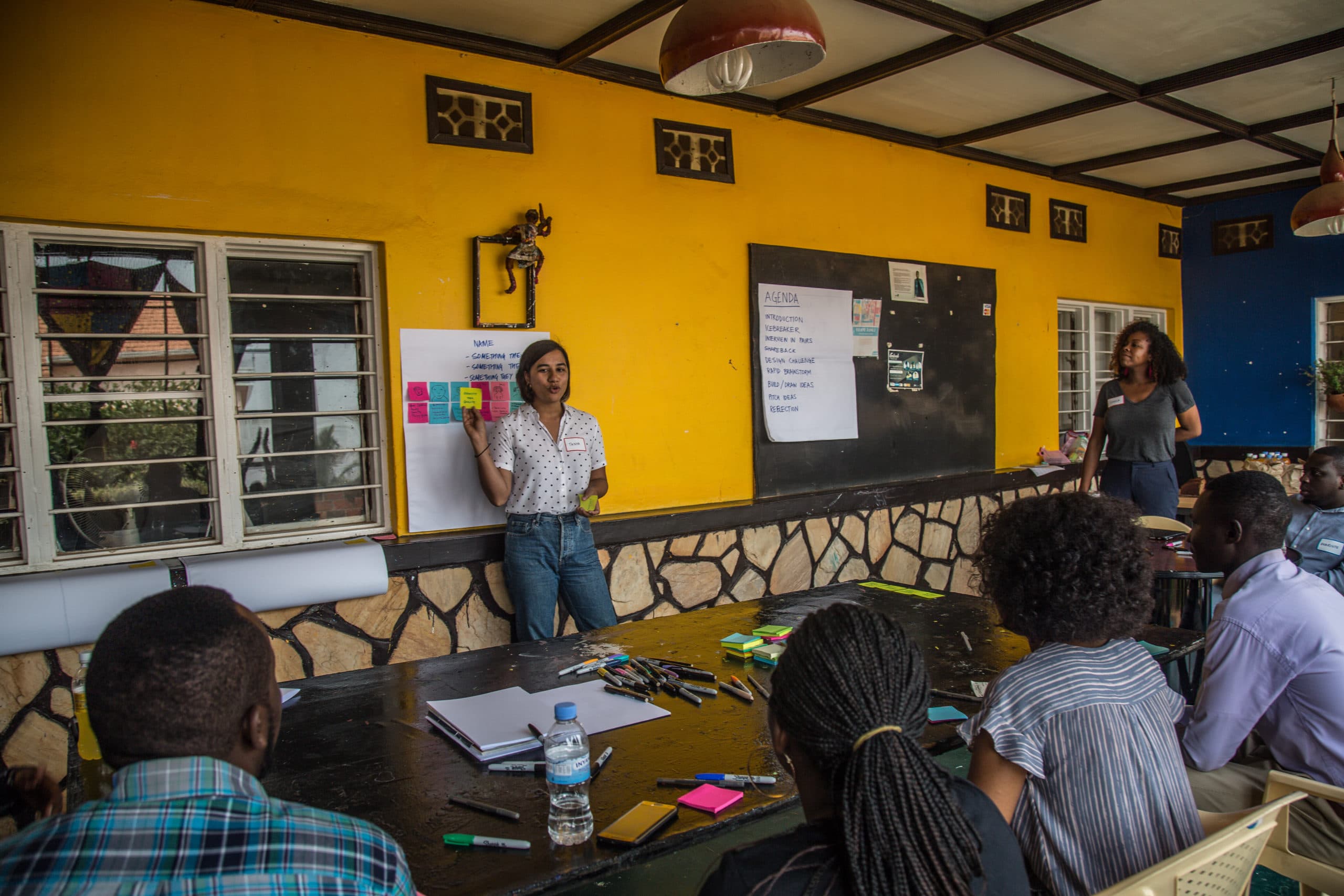 Facilitators reviewing charts and data with worker leaders